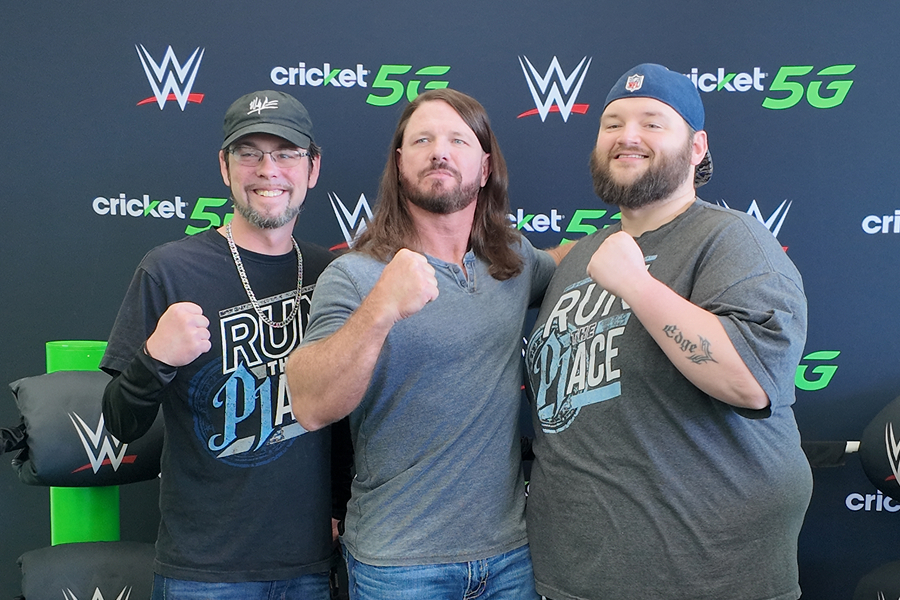 WWE fans celebrating at a Cricket Wireless-sponsored WWE event